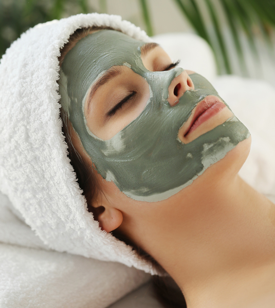 Woman receiving beauty treatment skin care