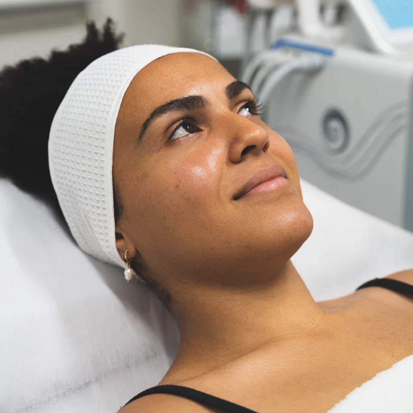 Happy woman after skincare procedure in Purify clinic