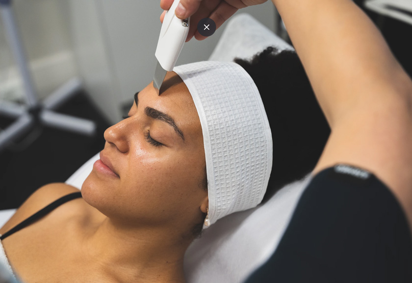 Woman doing facial in Purify Skincare Clinic